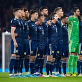 Scotland line up for the national anthems prior to the match against Poland at Hampden. (Photo by Ross MacDonald / SNS Group)