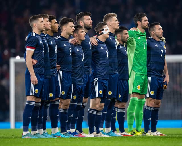 Scotland line up for the national anthems prior to the match against Poland at Hampden. (Photo by Ross MacDonald / SNS Group)