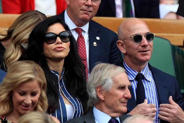 Amazon founder Jeff Bezos, seen wearing sunglasses at Wimbledon in 2019, is the world's richest person (Picture: Mike Egerton/PA Wire)