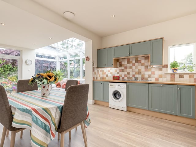 Interior: The owners have extended the property to the rear, where there is now an open-plan kitchen and dining space with sun room, and added a third bedroom and WC to the attic space. There is also a lounge and two double bedrooms.