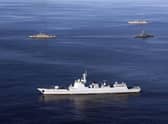 Warships take part in joint Iran-Russia-China naval drills held in the Indian Ocean and the Gulf of Oman in December (Picture: Iranian Army office/AFP via Getty Images)