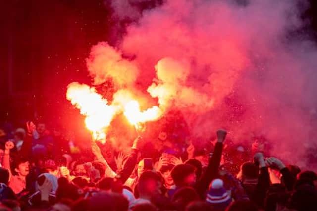Rangers fans lined the Clyde with flares on Friday night - but have been warned over similar scenes to the Edmiston Drive and George Square gatherings (above) that marked winning their title in March. (Photo by Craig Foy / SNS Group)