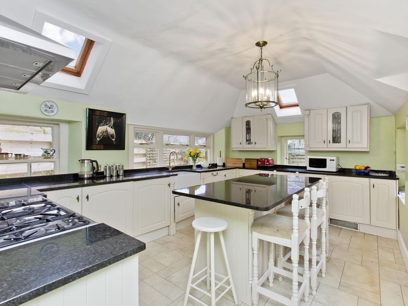 The kitchen sits to the rear of the property and is illuminated by skylights