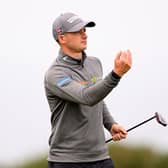 David Law throws his ball to stand-in caddie Michael MacDougall in the first round of the Hero Open at Fairmont St Andrews. Picture: Ross Kinnaird/Getty Images.