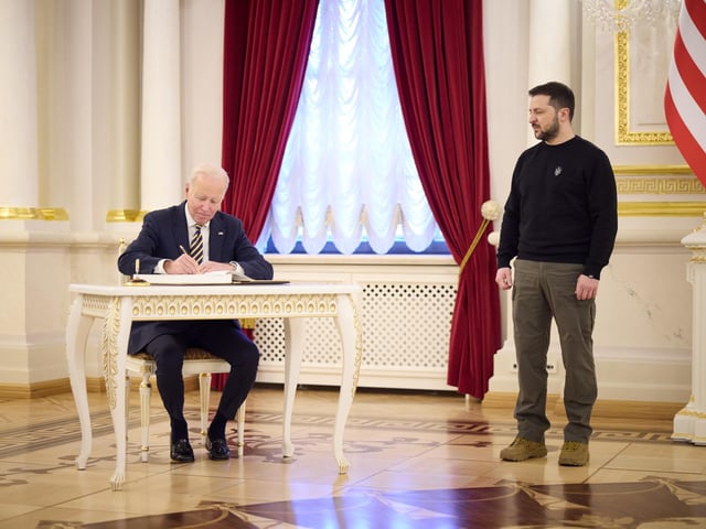 Handout photo issued by the Office of the President of Ukraine of President Volodymyr Zelensky welcoming US President Joe Biden to Kyiv, Ukraine. President Biden has made an unannounced visit to Ukraine in a gesture of solidarity days before the one-year anniversary of Russia's invasion of the country. Picture date: Monday February 20, 2023.