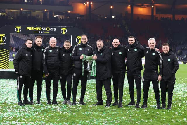 Celtic Manager Ange Postecoglou celebrates with the Premier Sports Cup Trophy alongside his backroom staff. (Photo by Craig Williamson / SNS Group)