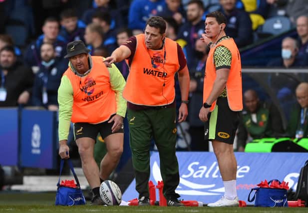 Rassie Erasmus, centre, gives out instructions to his South Africa players during the Autumn Nations Series match against Scotland at Murrayfield. (Photo by Stu Forster/Getty Images)