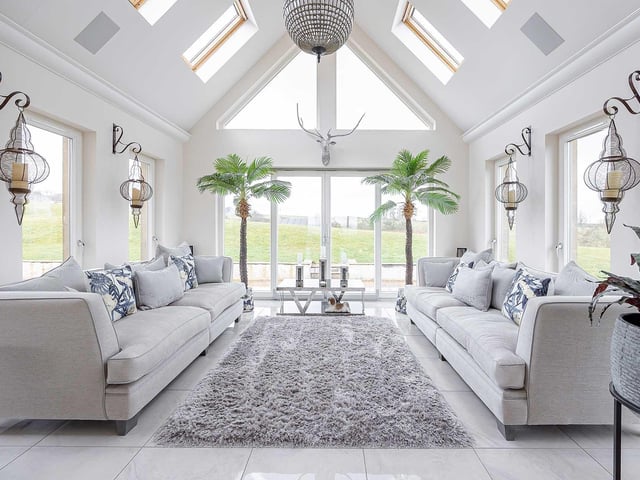 Interior The ground floor has been designed to be flexible with the use of open-plan spaces. There is a lounge and dining room, bedroom/study, and kitchen, with a family and sun room. Upstairs, a galleried landing leads to four generous bedrooms.