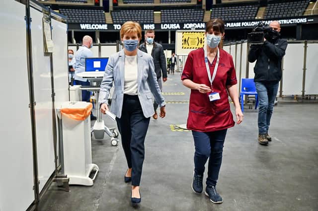 First Minister of Scotland Nicola Sturgeon arrives to receive her second dose of the Oxford/AstraZeneca Covid-19 vaccine at the NHS Louisa Jordan vaccine centre in Glasgow, Scotland. Picture date: Monday June 21, 2021.