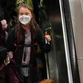 Climate activist Greta Thunberg gives a thumbs up arrives at Glasgow Central train station earlier this week ahead of the Cop26 summit.