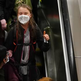 Climate activist Greta Thunberg gives a thumbs up arrives at Glasgow Central train station earlier this week ahead of the Cop26 summit.