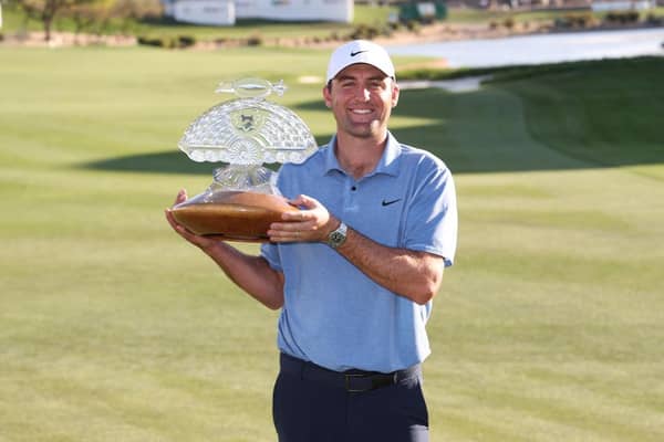 Scottie Scheffler celebrates with the trophy after his successful defence in the WM Phoenix Open at TPC Scottsdale. Picture: Maddie Meyer/Getty Images.