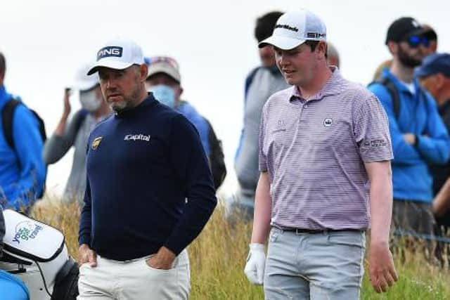 Bob MacIntyre and Lee Westwood chat during the first round of the abrdn Scottish Open at The Renaissance Club last week. Picture: Mark Runnacles/Getty Images.