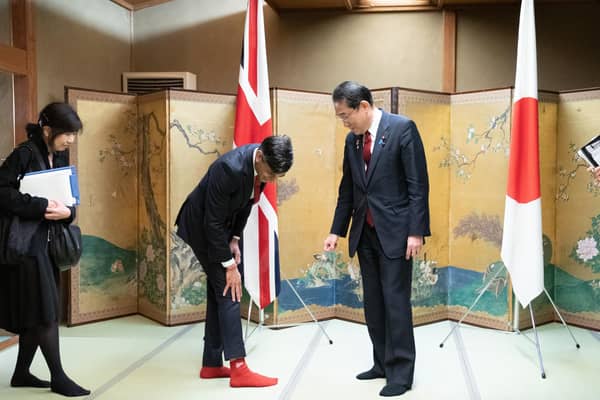 Rishi Sunak shows off his socks to Japanese Prime Minister Fumio Kishida during their bilateral meeting in Hiroshima ahead of the G7 Summit (Picture: Stefan Rousseau/WPA Pool/Getty Images)