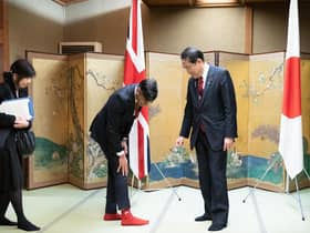 Rishi Sunak shows off his socks to Japanese Prime Minister Fumio Kishida during their bilateral meeting in Hiroshima ahead of the G7 Summit (Picture: Stefan Rousseau/WPA Pool/Getty Images)
