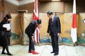 Rishi Sunak shows off his socks to Japanese Prime Minister Fumio Kishida during their bilateral meeting in Hiroshima ahead of the G7 Summit (Picture: Stefan Rousseau/WPA Pool/Getty Images)
