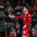 Andrew Robertson of Liverpool is congratulated by Jurgen Klopp.