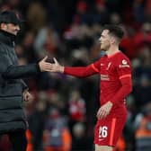 Andrew Robertson of Liverpool is congratulated by Jurgen Klopp.