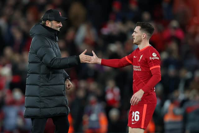 Andrew Robertson of Liverpool is congratulated by Jurgen Klopp.