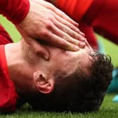 Andy Robertson of Liverpool reacts after an injury during the pre-season friendly match against Athletic Bilbao at Anfield