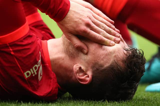 Andy Robertson of Liverpool reacts after an injury during the pre-season friendly match against Athletic Bilbao at Anfield