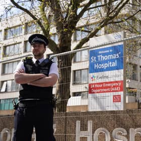 Police officers outside St Thomas' Hospital in central London where Prime Minister Boris Johnson has been admitted for tests as his coronavirus symptoms persist