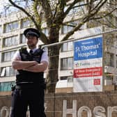 Police officers outside St Thomas' Hospital in central London where Prime Minister Boris Johnson has been admitted for tests as his coronavirus symptoms persist