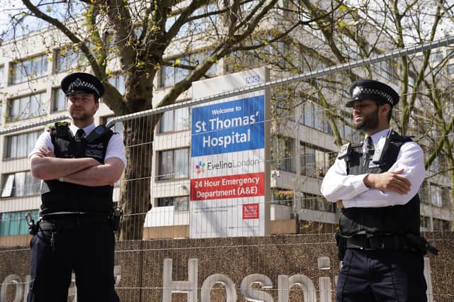 Police officers outside St Thomas' Hospital in central London where Prime Minister Boris Johnson has been admitted for tests as his coronavirus symptoms persist