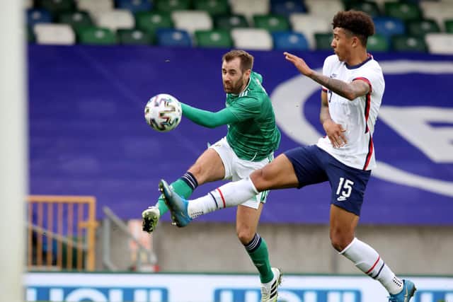 Northern Ireland's midfielder Niall McGinn (L) shoots to score their first goal during the international friendly football match between Northern Ireland and the United States at Windsor Park in Belfast on March 28, 2021. - USA won the game 2-1. (Photo by PAUL FAITH/AFP via Getty Images)