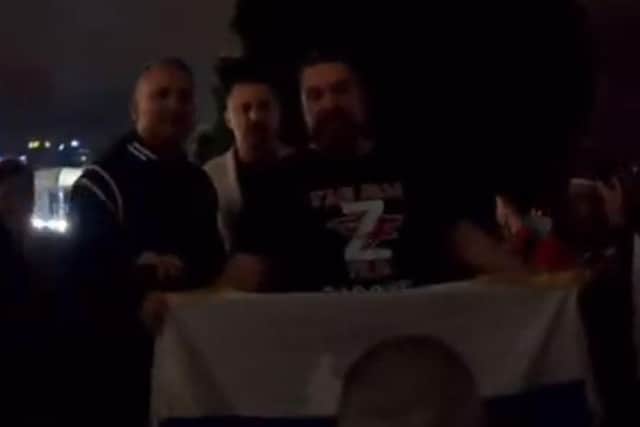 A screengrab of footage showing Novak Djokovic’s father at a pro-Russian demonstration at the Australian Open on Wednesday.