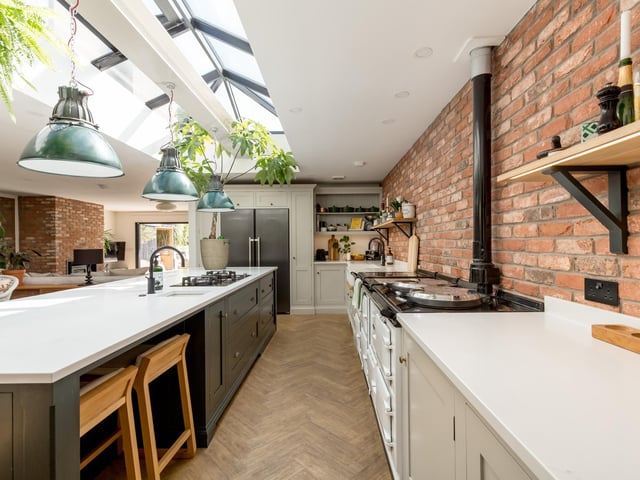 The open-plan kitchen dining area combines traditional and contemporary designs.