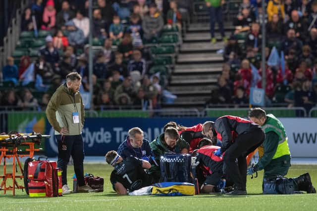 Rory Darge receives treatment after injuring his ankle in Glasgow Warriors win over Cardiff at Scotstoun. (Photo by Ross Parker / SNS Group)
