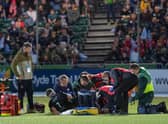Rory Darge receives treatment after injuring his ankle in Glasgow Warriors win over Cardiff at Scotstoun. (Photo by Ross Parker / SNS Group)