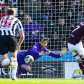 Jorge Grant puts Hearts ahead from the penalty spot.