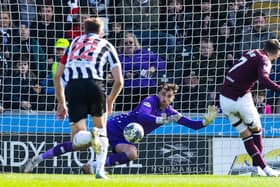 Jorge Grant puts Hearts ahead from the penalty spot.