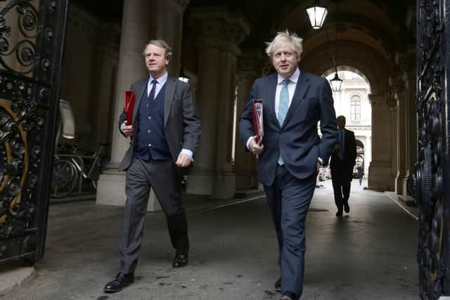 Alister Jack had claimed any independence referendum without UK Government approval would be 'illegal'. He is pictured here with Prime Minister Boris Johnson. Picture: PA Wire