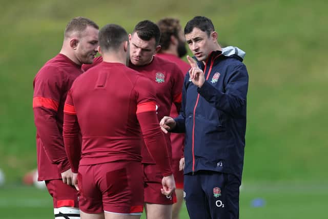 Felix Jones, the England defence coach, issues instructions during a training session.