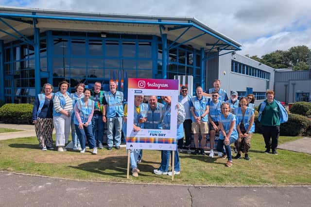 Some of the staff celebrating the anniversary outside the Dundee plant.
