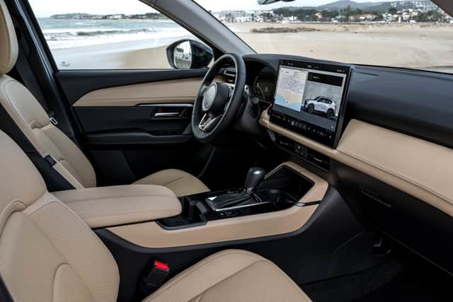 The whopping 15.6in touchscreen dominates the cabin
