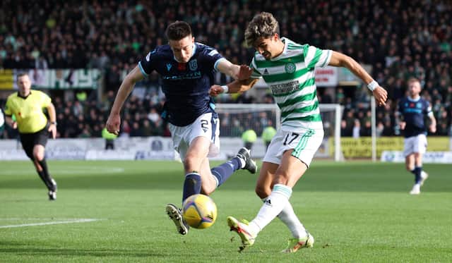 Celtic's Jota (gets a shot away under pressure from Dundee's Cammy Kerr, who admits Celtic's "relentless" movement made it impossible to quell the in-form winger, who grabbed two goals in the 4-2 victory at Dens Park. (Photo by Alan Harvey / SNS Group)