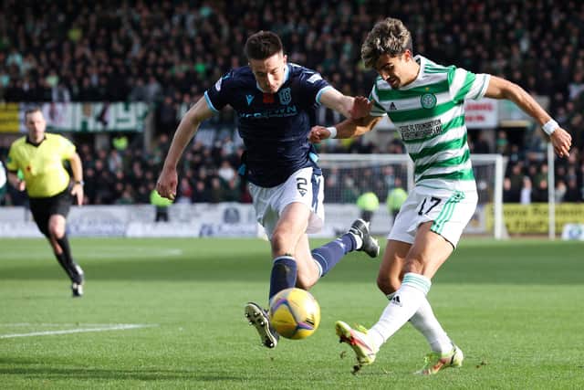 Celtic's Jota (gets a shot away under pressure from Dundee's Cammy Kerr, who admits Celtic's "relentless" movement made it impossible to quell the in-form winger, who grabbed two goals in the 4-2 victory at Dens Park. (Photo by Alan Harvey / SNS Group)
