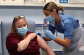 Deputy charge nurse Katie McIntosh administers the first of two Pfizer/BioNTech Covid-19 vaccine jabs to Vivien McKay Clinical Nurse Manager at the Western General Hospital, in Edinburgh.