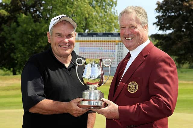 In his role as PGA Captain at the time, Jim Farmer, right, presents DJ Russell with the trophy after his win in the DeVere Collection PGA Seniors Championship at Slaley Hall in 2010. Picture: Phil Inglis/Getty Images.