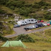 Car parks and beauty spots along the A838 are busy as tourists take to the North Coast 500 route in Ullapool, Scotland (Photo by Paul Campbell/Getty Images)
