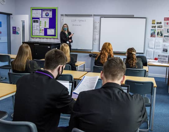 Pupils wear masks during class at Armadale Academy.
Higher History S5/S6 Armadale Academy students/pupils wear masks in the classroom along with their teacher
West Lothian has been placed into Tier 3 alon with the rest of the Central Belt
COVID 19, CORONA VIRUS - From today teachers and S4-S6 pupils must wear face masks/face coverings in classrooms in the new tier 3 and tier 4 COVID 19 restrictions.
Senior pupils and their teachers are being advised to wear face coverings in classrooms for schools in the new level 3 and 4 restriction areas.
The Scottish government has released new guidance on school safety to take account of the five-level Covid alert system, which begins on Monday.
Other guidance advises staff to wear face coverings in all schools, where social distancing is not possible.
And parents should wear masks even at drop-off and pick-up.