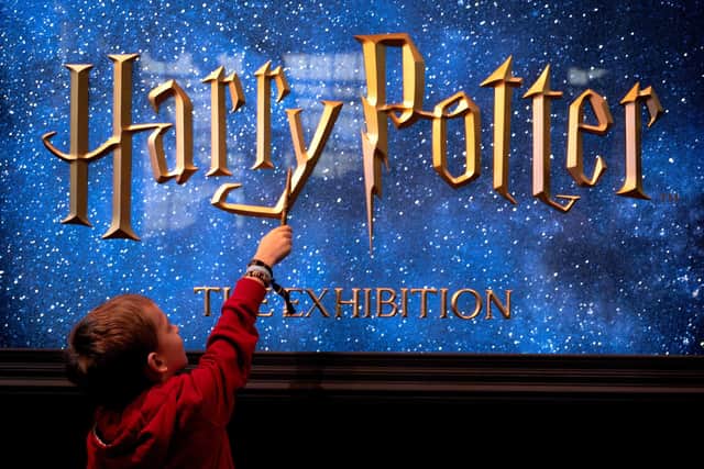 A young visitor holds a magic wand during the opening of the European exhibition of Harry Potter in Vienna. Picture: Andrea Klamar-Hutkova/AFP via Getty Images