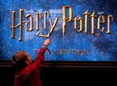 A young visitor holds a magic wand during the opening of the European exhibition of Harry Potter in Vienna. Picture: Andrea Klamar-Hutkova/AFP via Getty Images