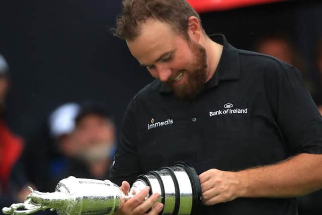 Shane Lowry gazes at the Claret Jug after his win the 148th Open at Royal Portrush in 2019. Picture: Andrew Redington/Getty Images.