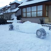 Brody Penny in the racing car made from snow.