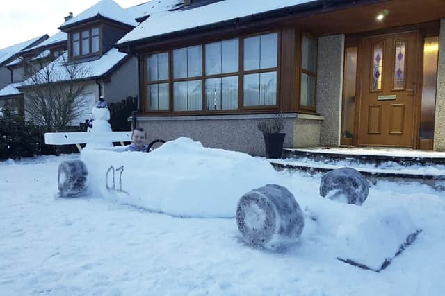 Brody Penny in the racing car made from snow.